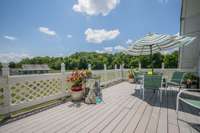 Deck of Bardominium looks out over pasture land.