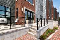 The front entry features a spacious seating area off Madison. The property is part of the historic Elliott School development.