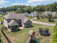 Let your pets run or play a game of catch in the fenced back yard while the mature evergreens provide privacy.