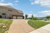 The 3-Car Garage has plenty of room for your vehicles and extra room for a refrigerator, windows for natural light, and tall ceilings for possible loft storage.