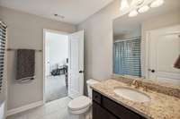 Shared between Bedroom #4 & the Bonus Room, this Bath includes a vanity with granite countertop, brushed nickel fixtures, linen closet, shower/tub combo, and tile flooring.