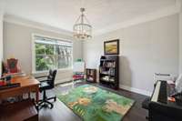 The Study is located just off of the Foyer through a cased opening and offers a double window and brushed nickel light fixture.