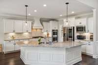 The Kitchen is always the heart of the home. This Kitchen includes appointments such as granite counters, soft-close drawers, tile backsplash, gorgeous tile accent over the cooktop, and recessed lighting.