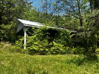 14x24 pavilion with metal roof & concrete floors in good condition.