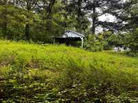 14x24 pavilion with metal roof & concrete floors in good condition.