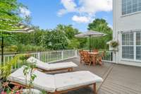 The freshly stained Deck can accommodate most patio sets and a grill, making it great for entertaining.