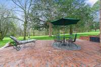 Stamped concrete front porch extends to the side of the house and provides lots of extra space for entertaining.