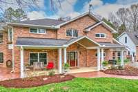 Large front porch is perfect for sitting and watching the deer and turkeys that wander the property.