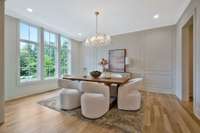 Formal Dining Room with an Incredible View, Luxury Lighting and Custom Millwork is positioned to the Left of the Front Door