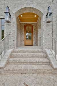 Gorgeous Gas Lanterns Flank the Arched Covered Porch & You & Your Guests