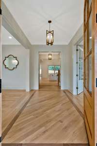 Custom Walnut Inlaid Floors Greet You at the Entry Hall