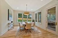 The Light Filled Breakfast Room is Filled has Access to the Screened Porch