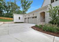 Oversized 3 Car Garage and Arched Covered Entrance to the Neighbor Door