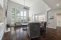 The living room has a speaker system that also extends to the back deck and a gas fireplace.