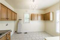 Oversized Utility room with tiled floor!