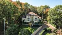 Stately home perfectly situated on the hillside with an easy drive to the top with lots of parking