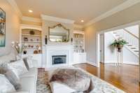 Unwind in the comfort of a serene sitting or reading room, where a charming bay window frames a majestic view