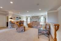 Endless possibilities in the spacious loft room with wet bar, perfect for relaxing or entertaining