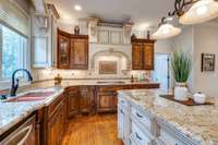 Gourmet kitchen with custom cabinets, granite countertops, state of the art appliances and walk-in over-sized pantry