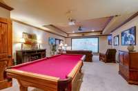 Expansive basement includes sleek pool table & projector TV leading into the incredible 2-room wine cellar