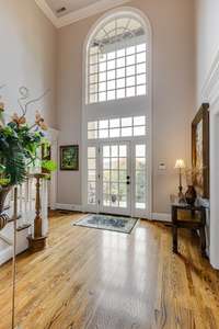 Experience the breathtaking panoramic views through the stunning  30-ft  arch windows that overlook the picturesque valley