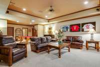 Step into the ultimate entertainment zone in this expansive finished basement with full bathroom