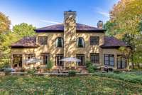 Enjoy the quiet & serene backyard that backs up to mature trees offering added privacy and natural beauty