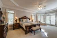 Retreat to an over-sized master bedroom with a cozy fireplace. This spacious room has a double trey ceiling and abundant natural light overlooking the private back yard