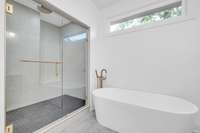 Large custom walk-in shower with a place to even sit and relax.