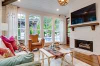 Quite possibly the best seat in the house! A light filled sunroom overlooking the pool area