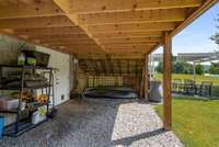 Storage area under the sunroom leading to the basement.