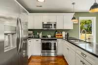 Stainless steel appliances and quartz countertops