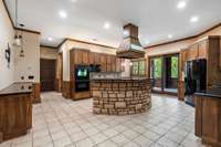 kitchen is open to main living space, yet defined and out of the way