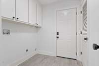 Laundry Room complete with custom tile and brand new hot water heater