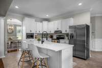 Cook and create with ease in a beautifully updated kitchen featuring spacious island seating. Quartz countertops and stainless steel appliances add a touch of luxury to the functional heart of this home. Perfect for meal prep and casual dining.