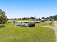 An additional 2-bedroom, 1-bath mobile home on the property offers flexibility for rental income or housing for a farmhand. With its own utilities, it’s a self-sufficient and practical addition to the estate. This valuable feature is included as-is.