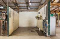 Pamper your horses in the barn’s dedicated horse shower area, featuring all the amenities needed to keep them clean and comfortable while grooming. This space is designed with your equine companions in mind.