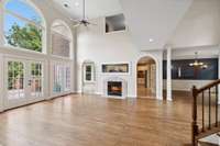 Fireplace and aquarium join the living room to the kitchen and breakfast nook.