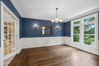 Beautiful dining room incorporates natural light while overlooking front lawn.  Entertainers dream with access from kitchen and foyer.