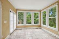 Breakfast nook overlooks the back of this estate and opens to one of two outdoor entertainment spaces.