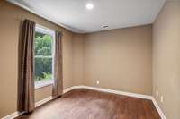 One of two bedrooms in walk out basement allow for separate living space.