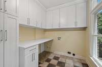 Large with ample storage and adjacent to kitchen allows the space to be used as a pantry as well as laundry room.