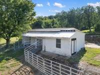 Strategically located near the pastures and outdoor riding arena, the barn allows for seamless transitions between different activities, enhancing the overall experience for both horse and rider.