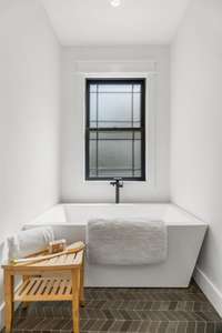 Additionally, there's a separate soaking tub, perfect for enjoying a long, relaxing bath.