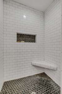 PRIMARY Bathroom.... The Oversized Tile Shower IS EVERYTHING!!! Bench Seat + Shampoo Niche