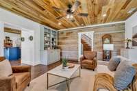 STUNNING Architectural Details in the Great Room. Exposed Log Walls, Wood Plank Ceiling + Modern + Energy Efficient Windows