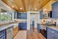 LUX KITCHEN w/ Beautifully Upgraded Cabinetry Mix of Granite + Butcher Block Countertops