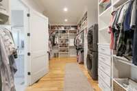 Huge closet with built-ins and stackable washer and dryer