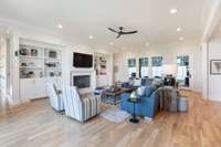 Custom built-ins surround the Arca-stone fireplace