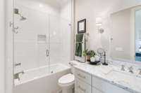 All bathrooms offer glass enclosures and convenient niches